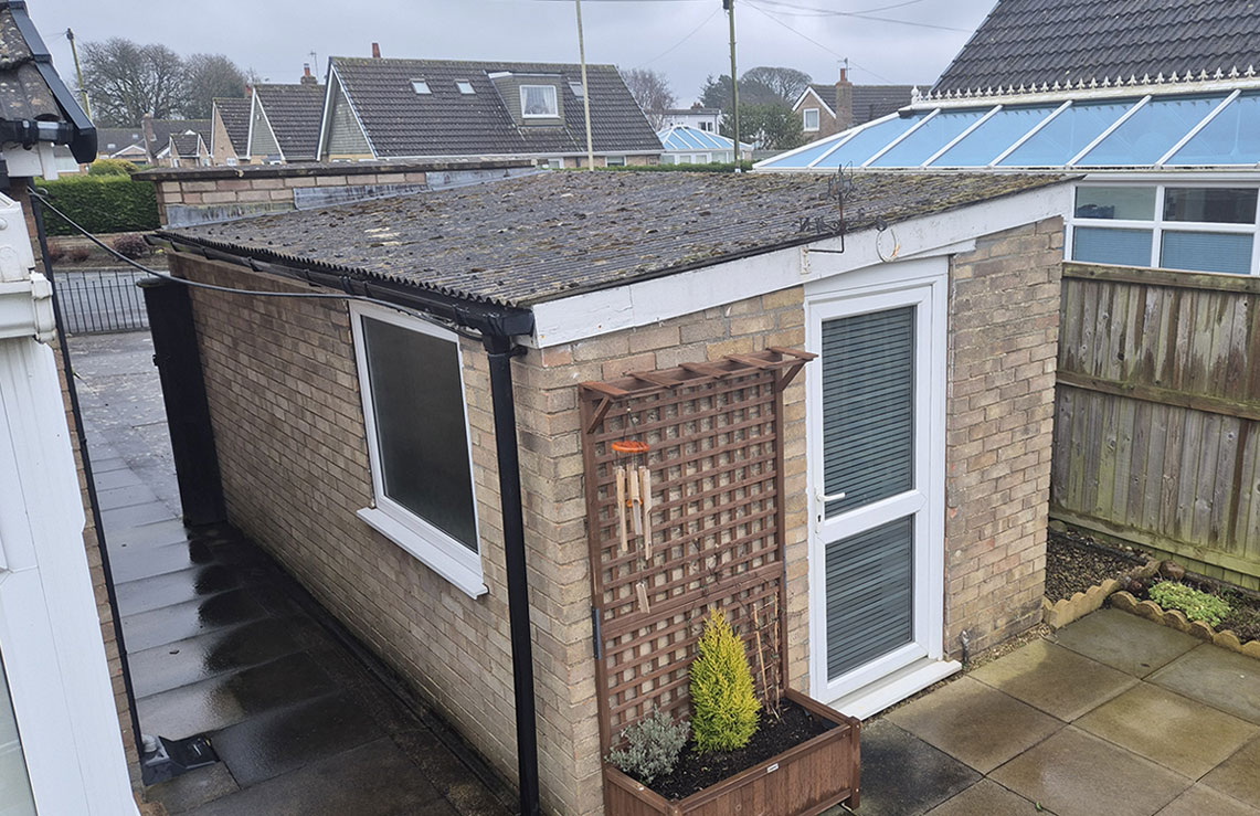 garage with asbestos roof
